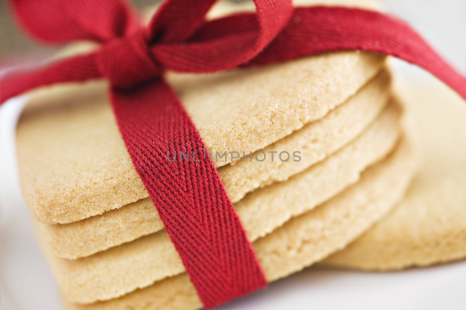 Heart shaped cookies with red ribbon on cloth