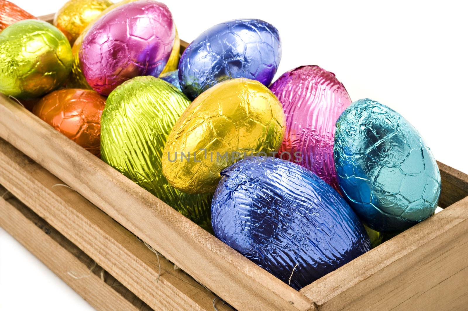 Colorful easter eggs in a box on a white background