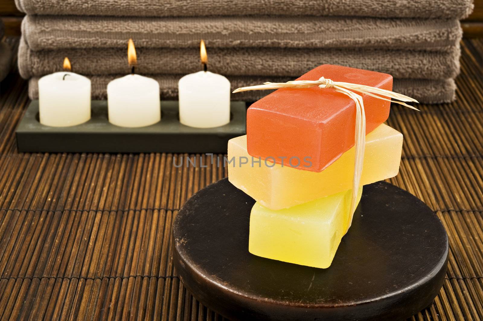 Soap candles and towels in a spa - shallow depth of field