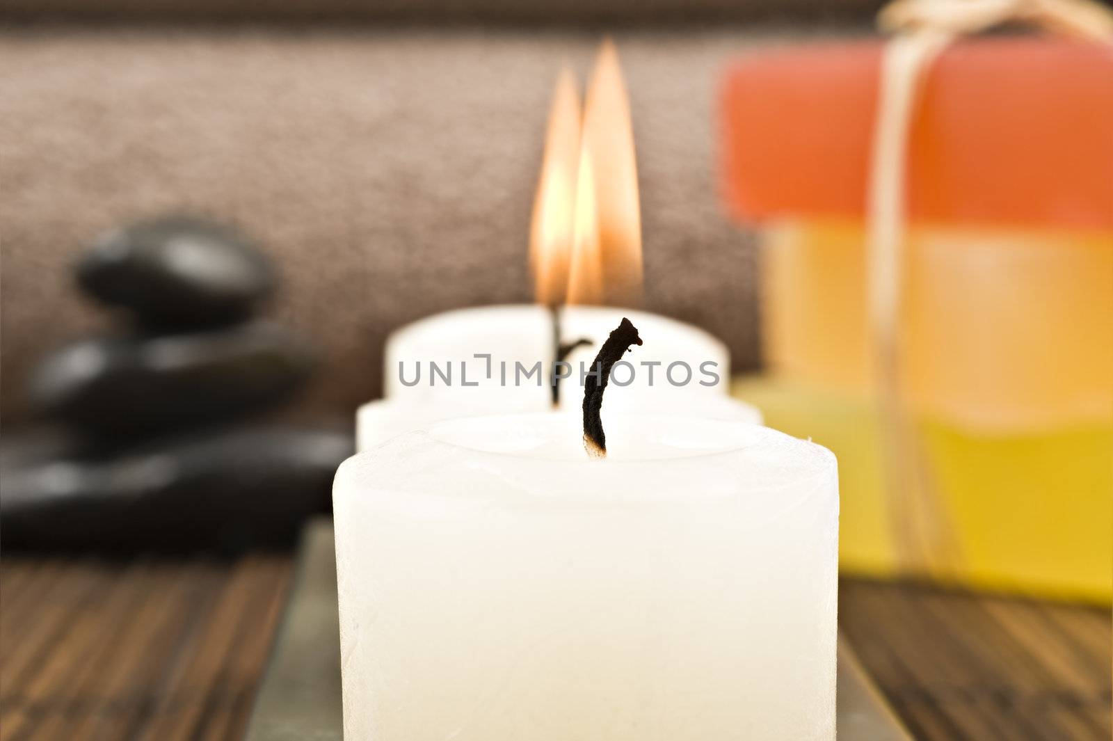 Soap candles and towels in a spa - shallow depth of field