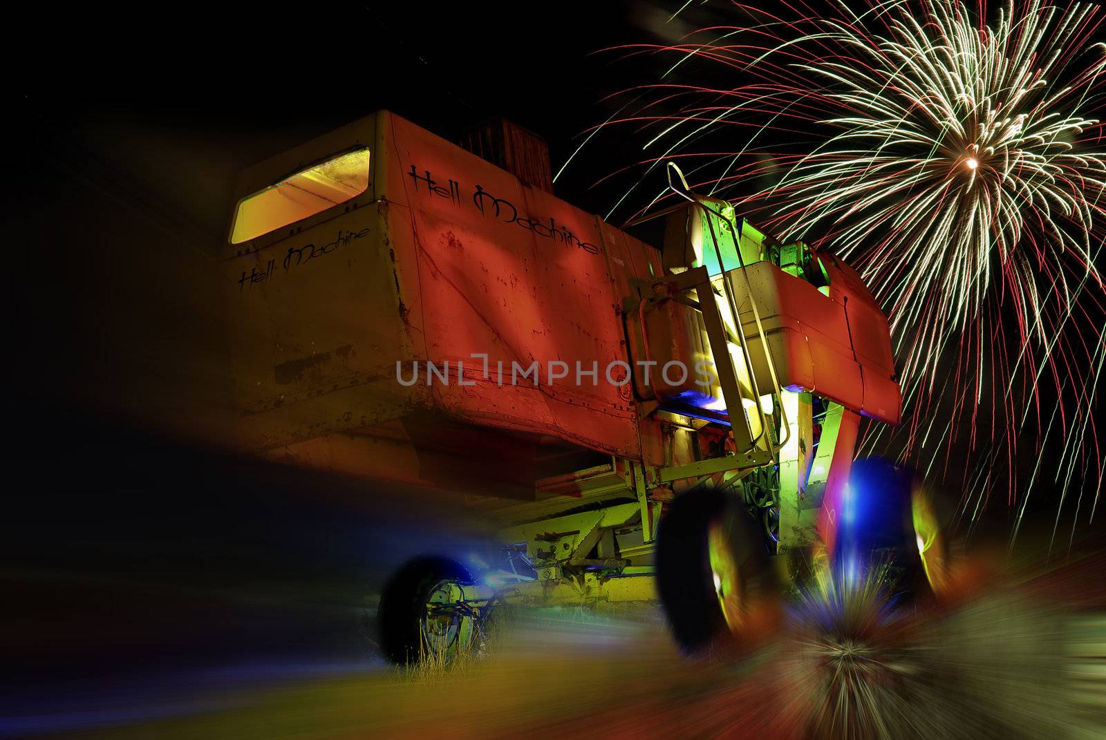 An old harvesting machine painted with light and some fireworks.