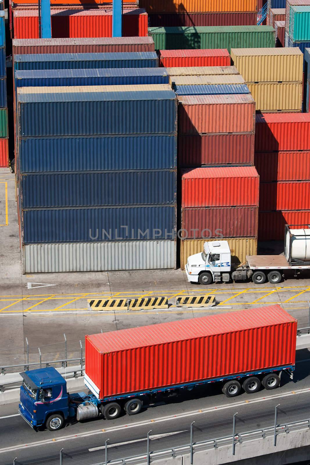 Truck carrying a container to the cargo area of the port