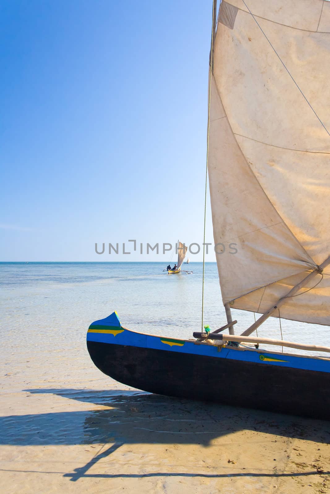 Malagasy outrigger pirogue with makeshift sails