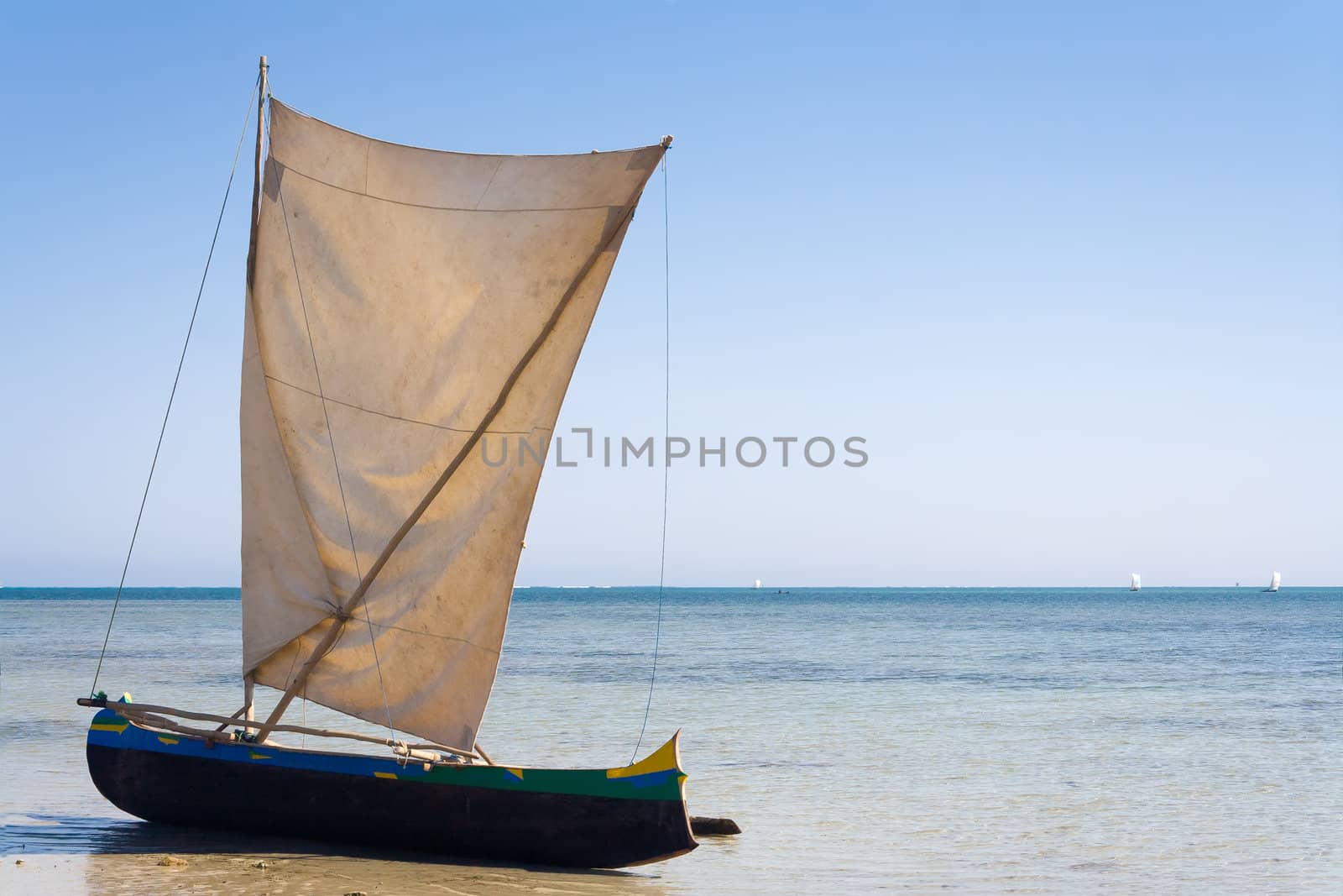 Malagasy outrigger pirogue with makeshift sails