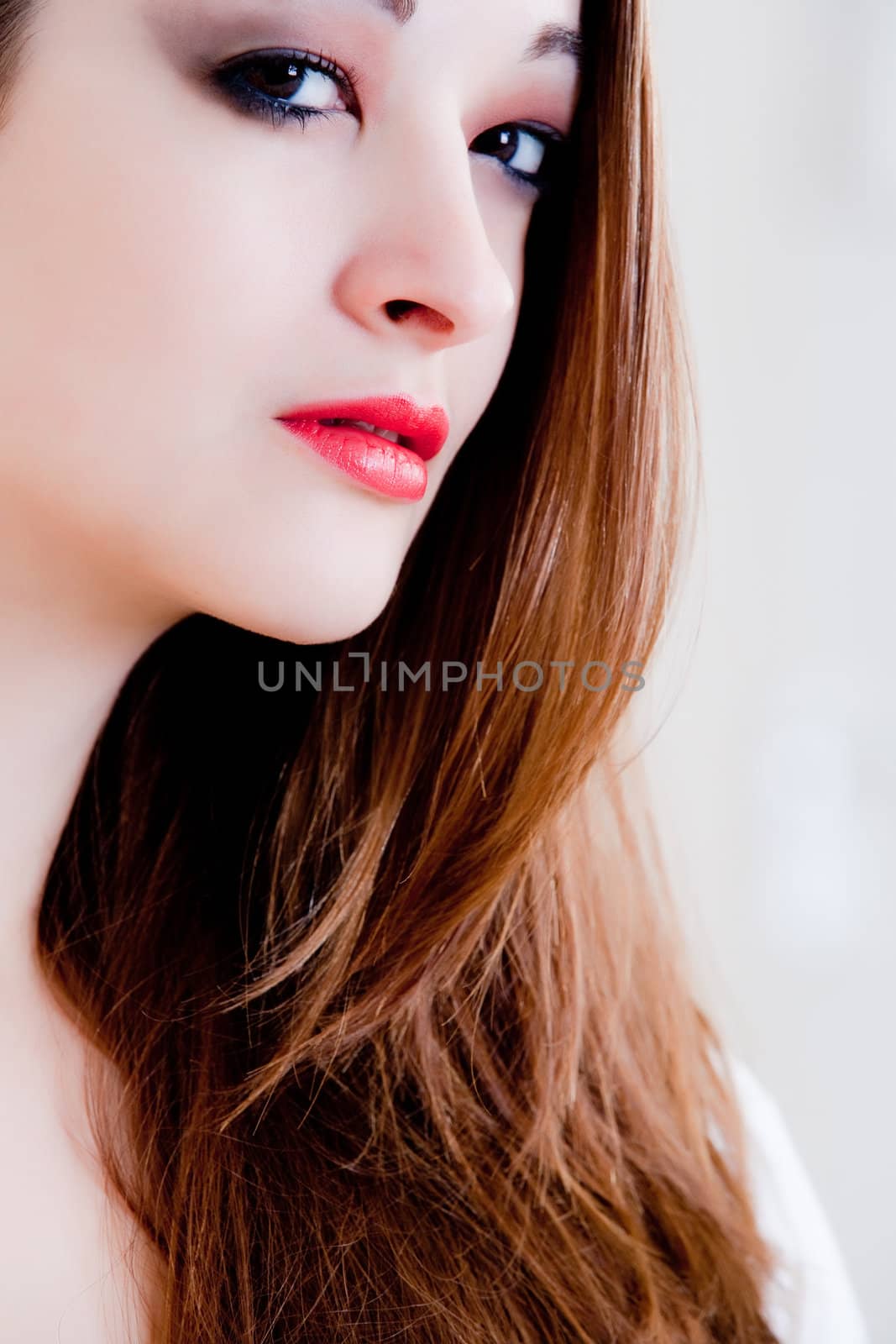 Beautiful woman in a bedroom resting and relaxing