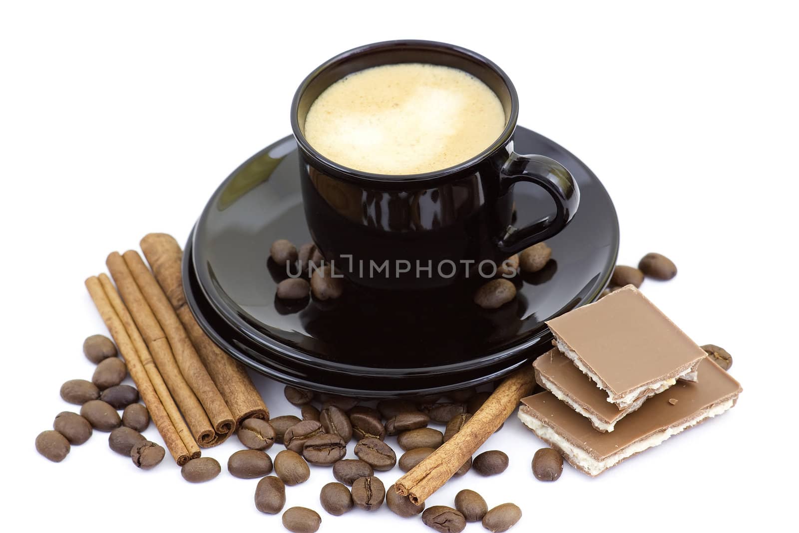 cup of italian espresso with cinnamon, coffee beans and chocolate