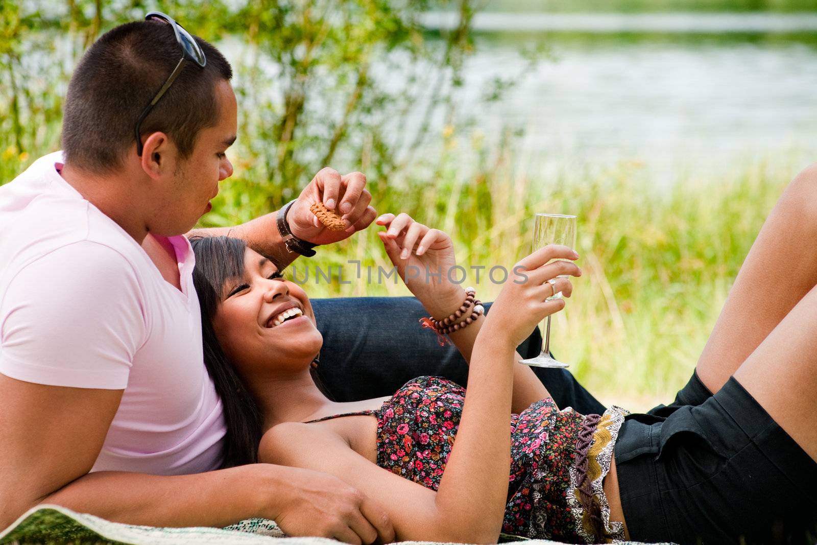 Young happy asian couple enjoying their time outdoors
