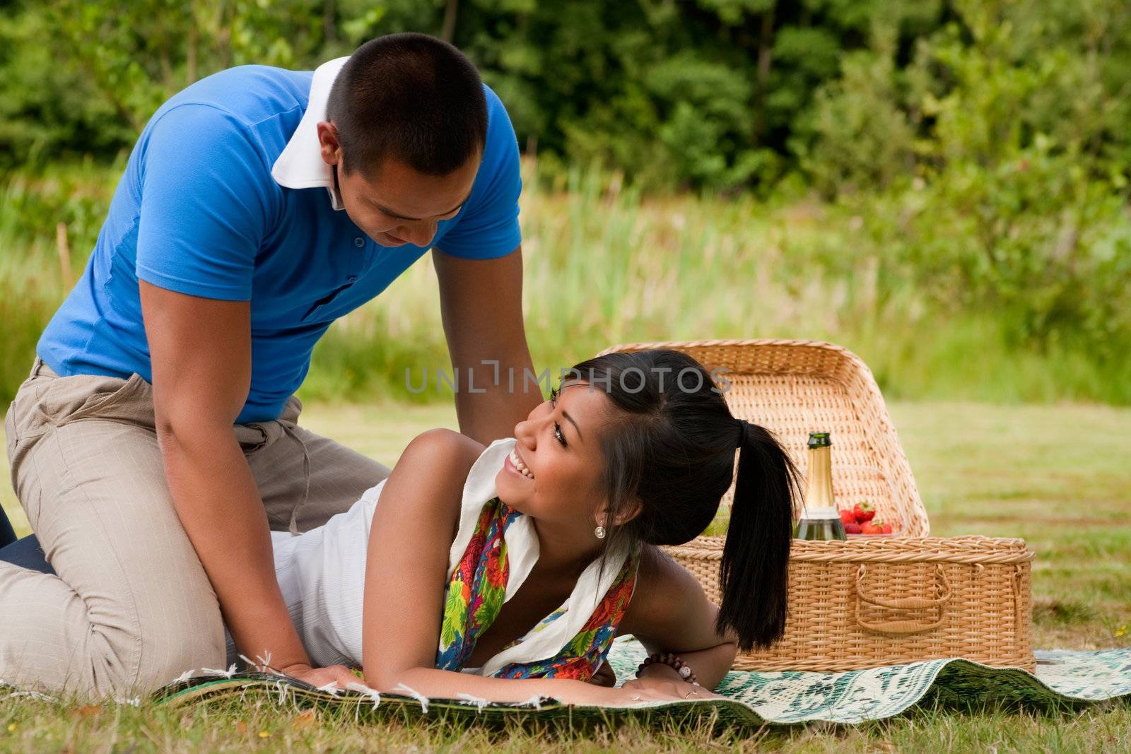 Young happy asian couple enjoying their time outdoors
