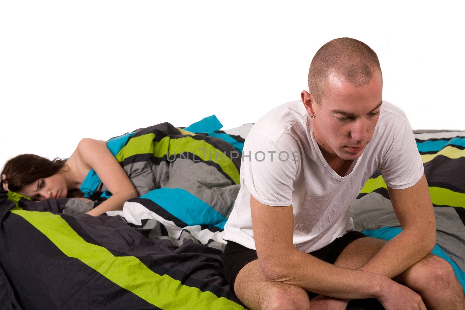 Young worried couple in bed with relation problems by DNFStyle
