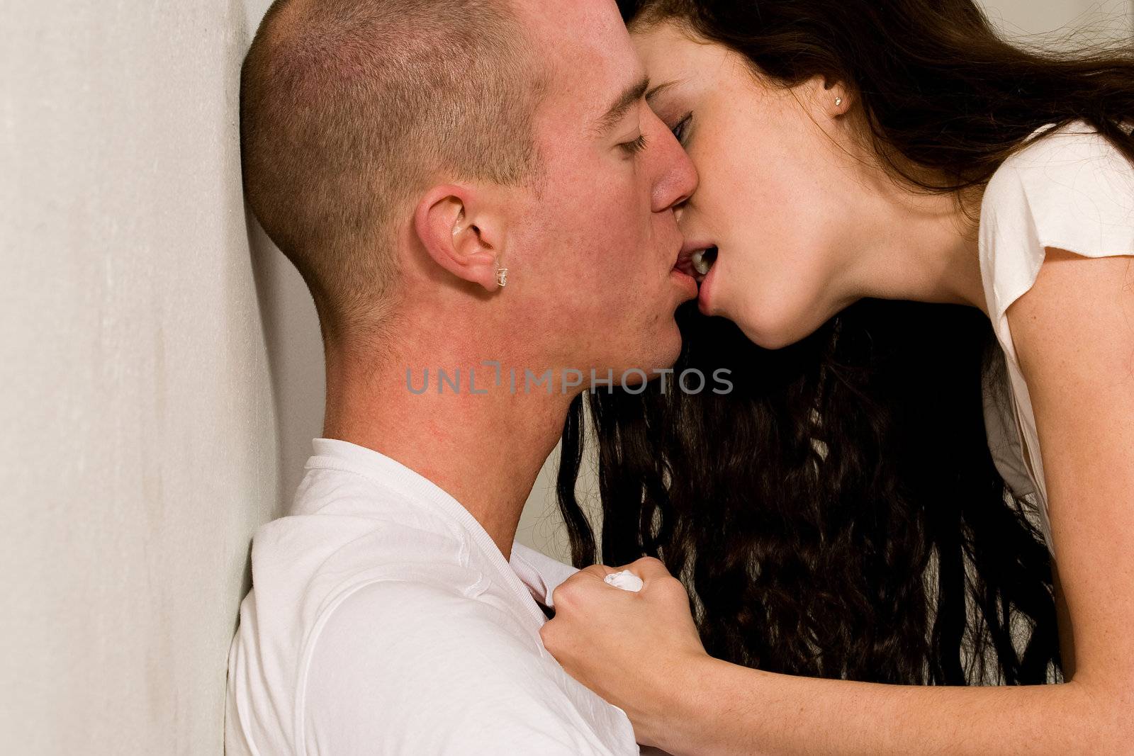 Young couple who are in love a passionate kiss by DNFStyle