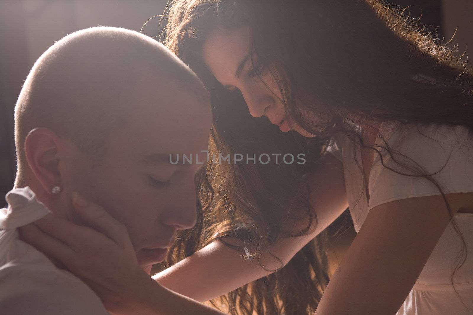 Passionate loving couple in bright light by DNFStyle