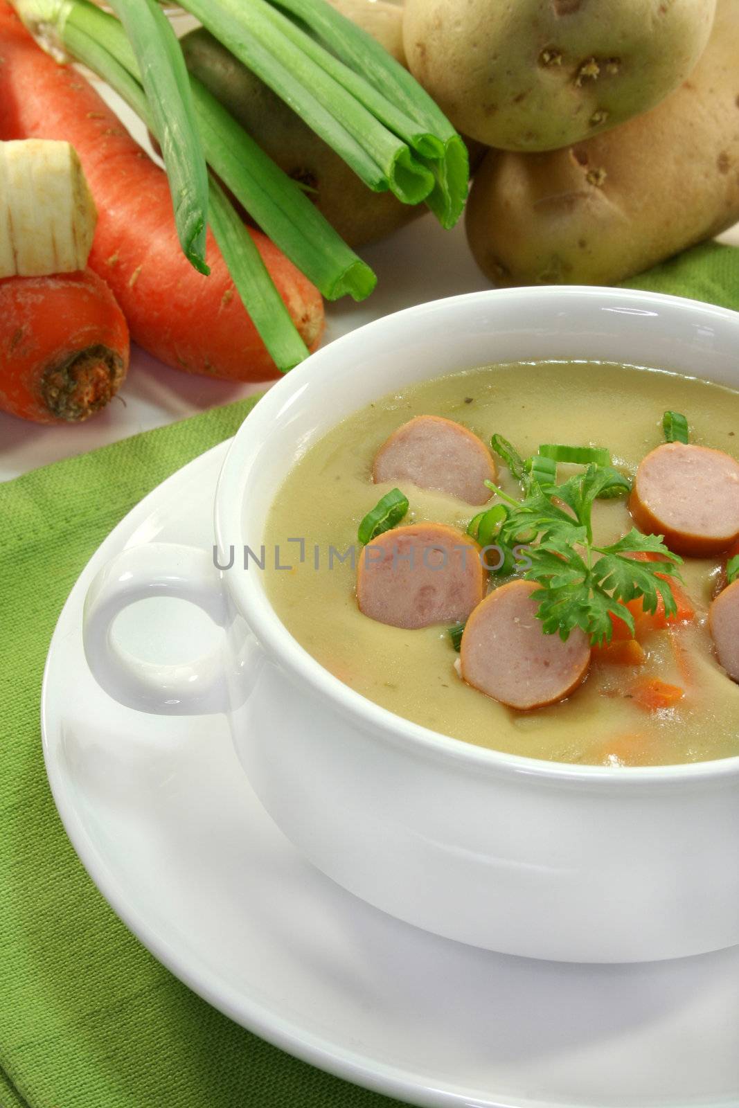 Cream of potato soup with vegetables and Vienna sausages