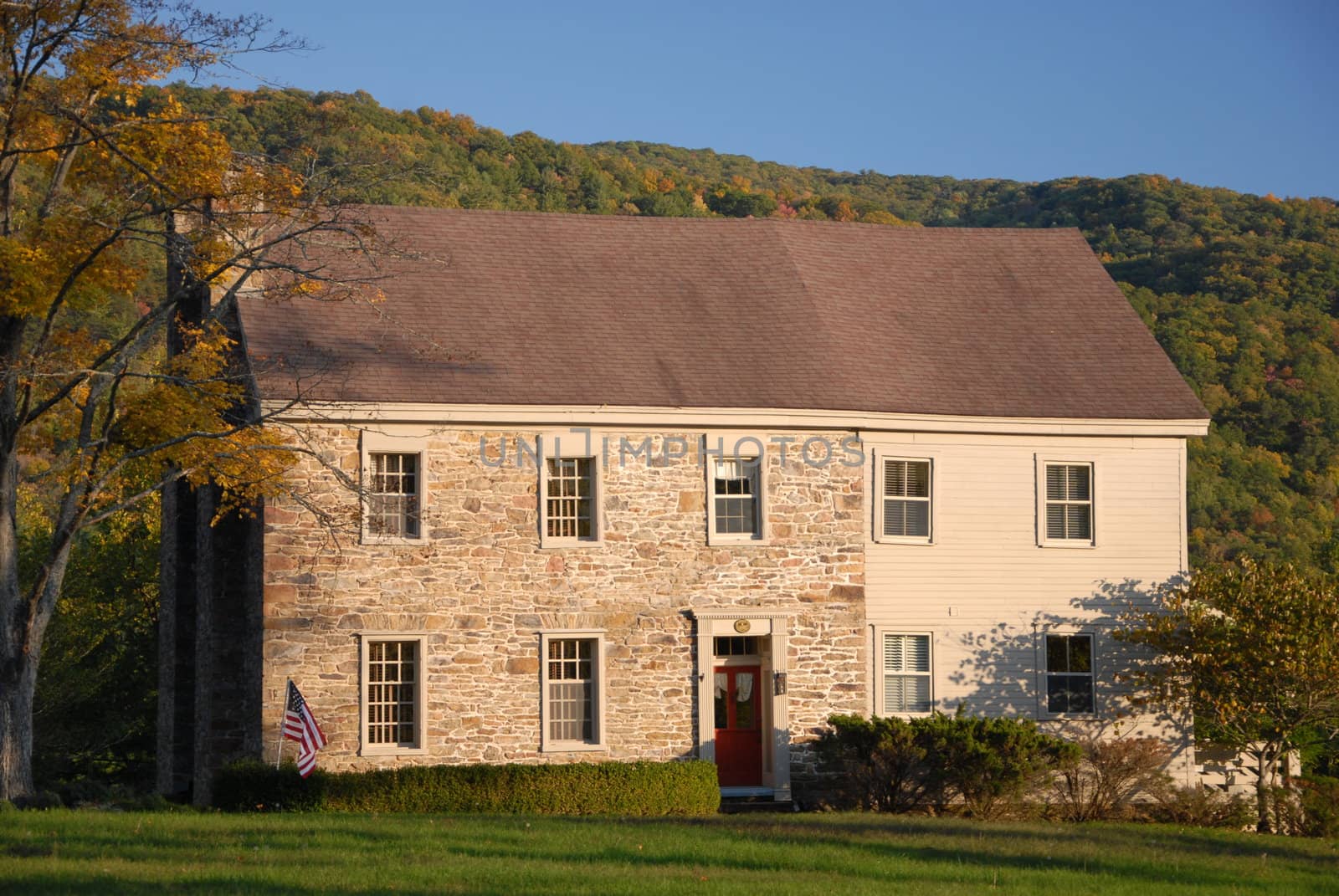An old stone house in the fall of the year