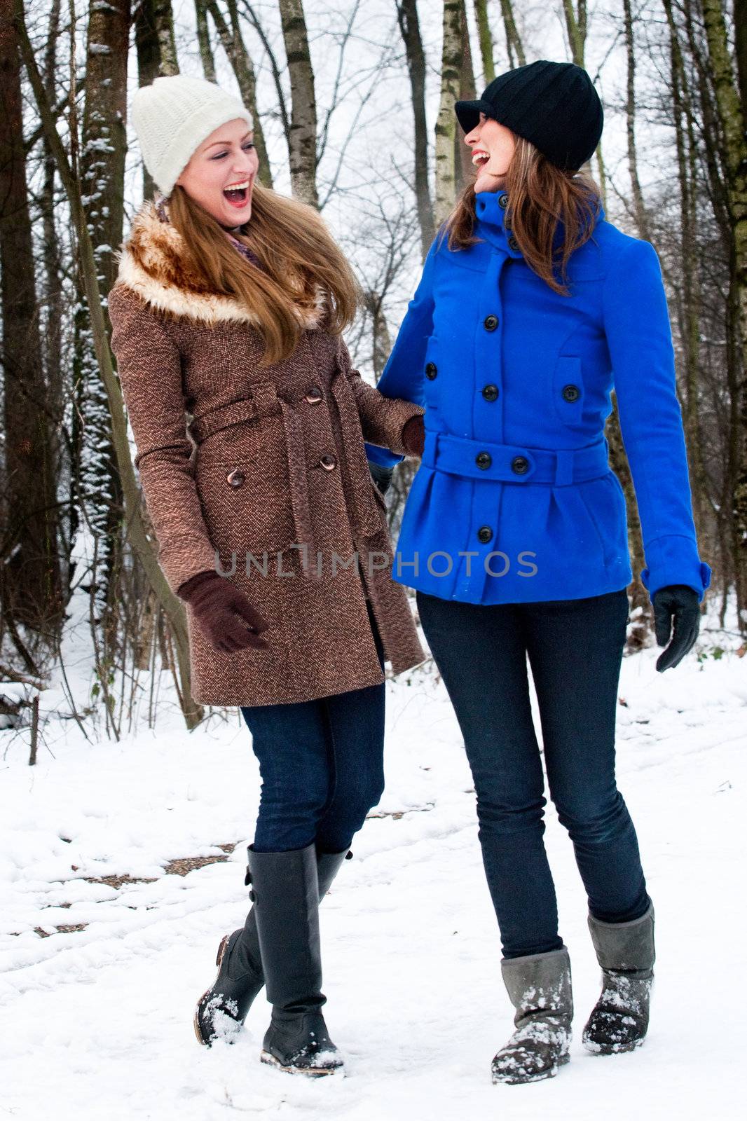 sister laughing on a winter white road by DNFStyle