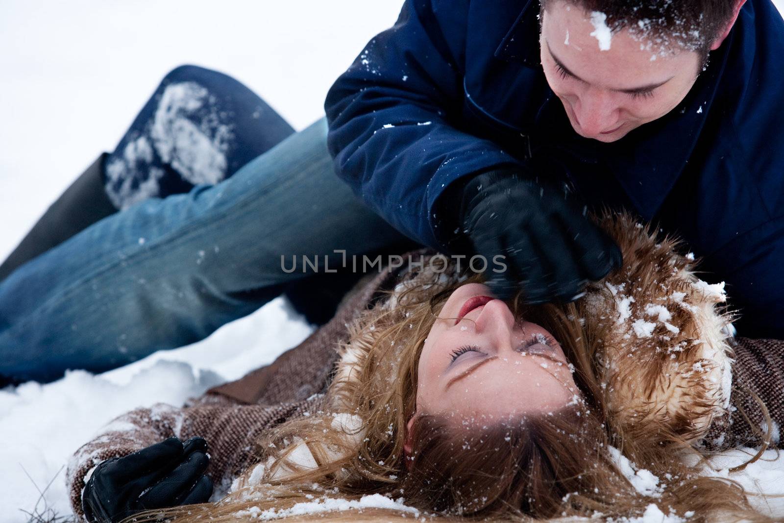 couple being passionate about eachother in winter
