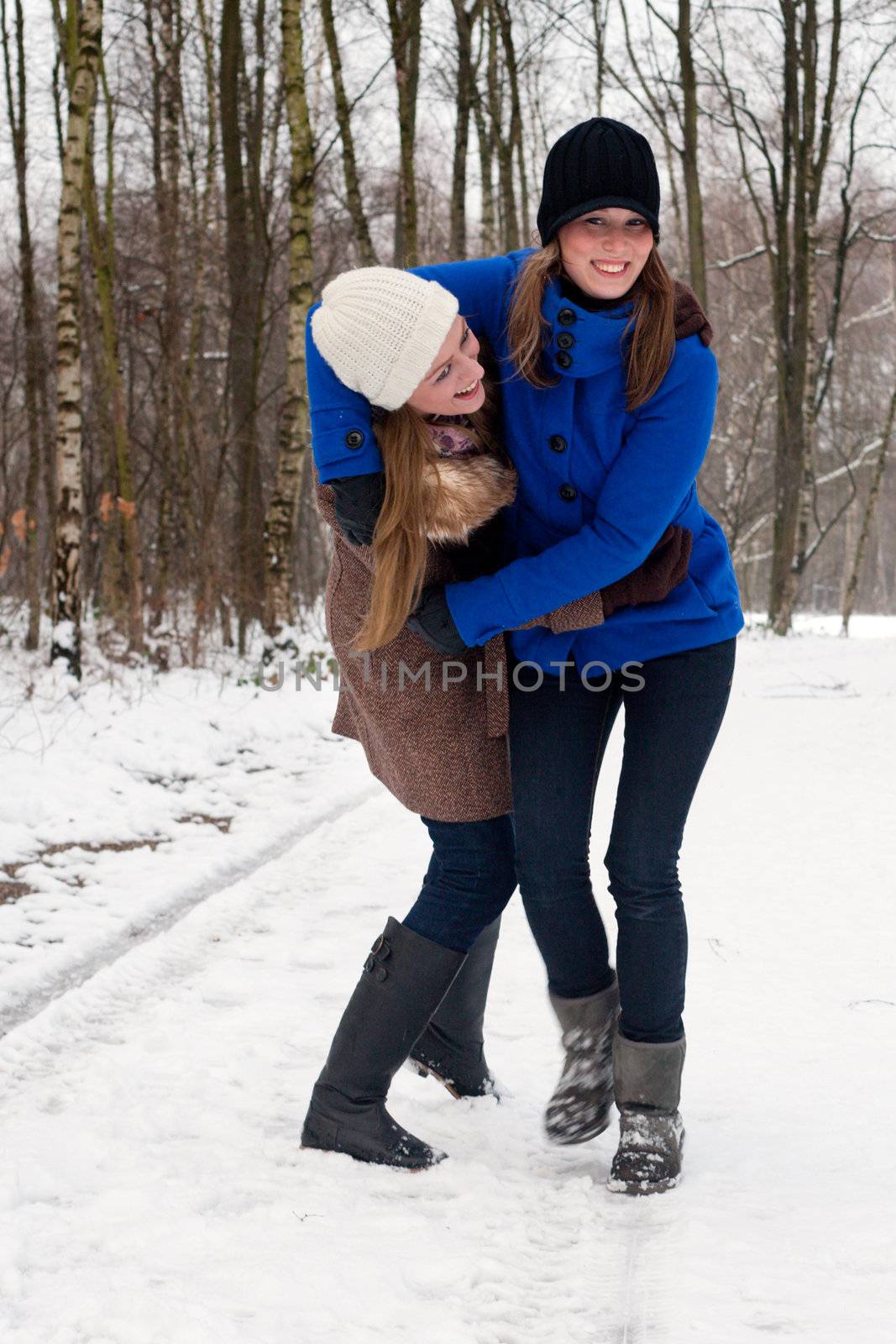 sisters having fun during a winter hike