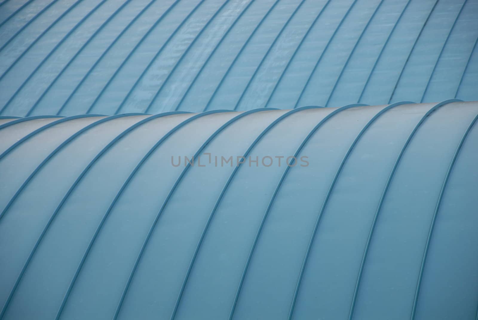A close view of a curved blue roof