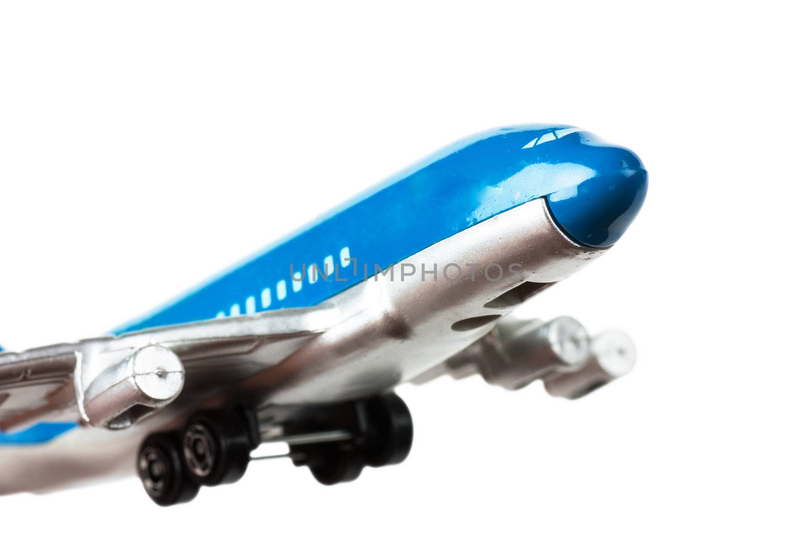 Passanger airplane toy isolated over white background.