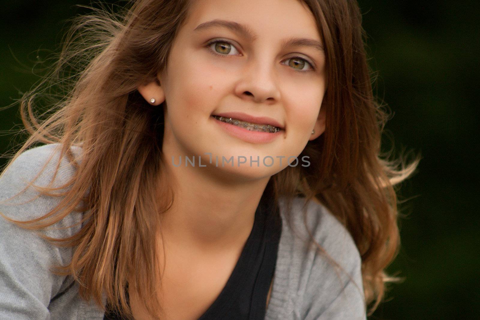 Young summer girl portrait in the grass