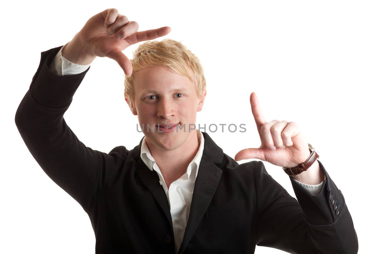 a young man framing his face with his hands