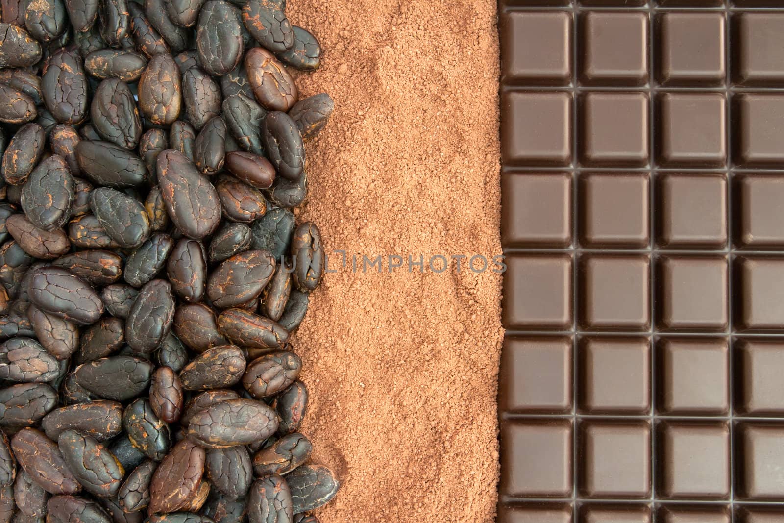 Bar of chocolate, cocoa powder and cocoa beans