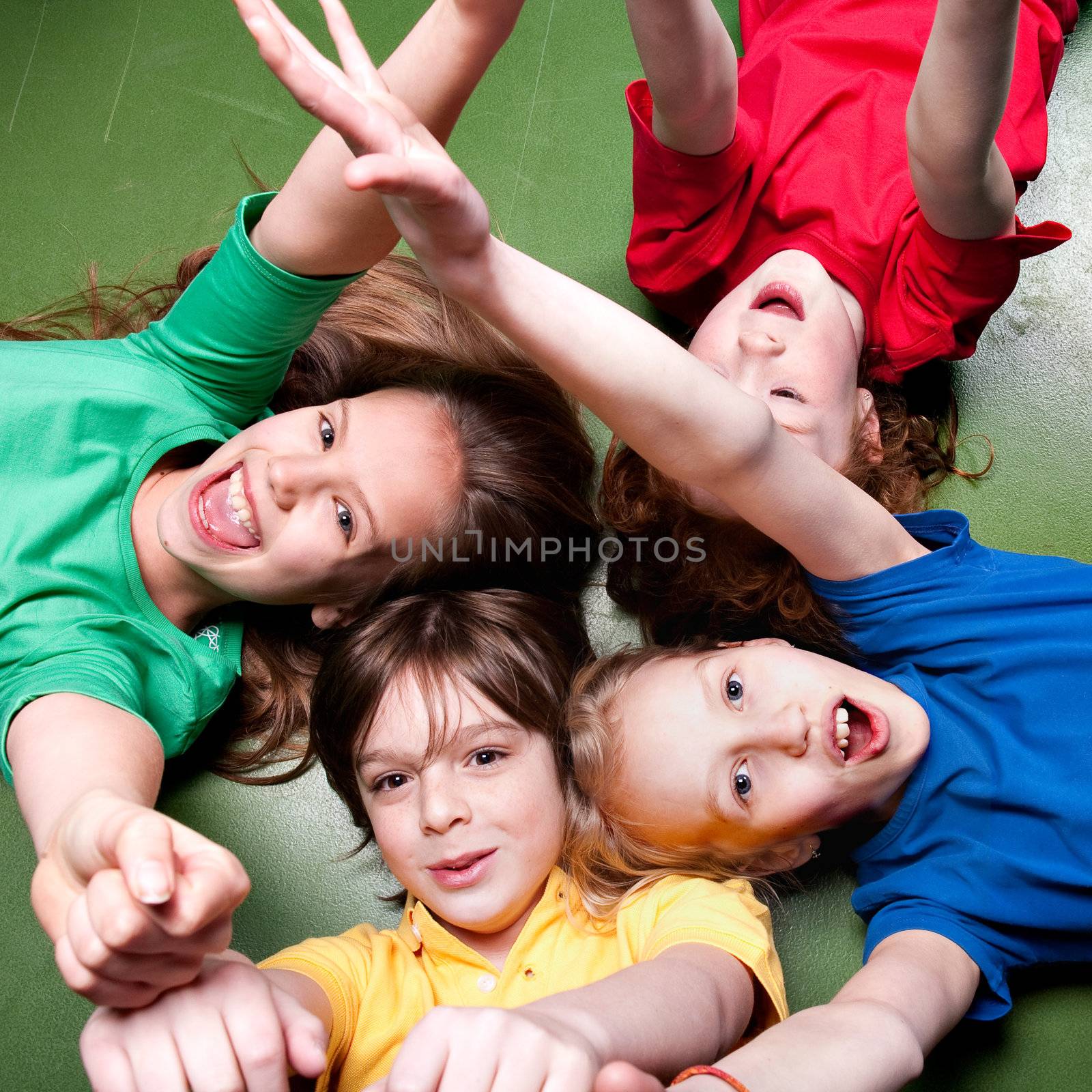 Group of little students with different ages in a happy mood
