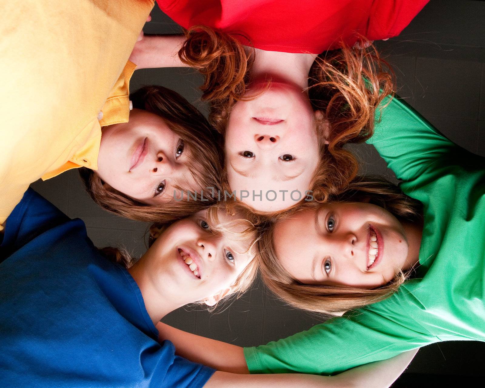 Group of little students with different ages in a happy mood
