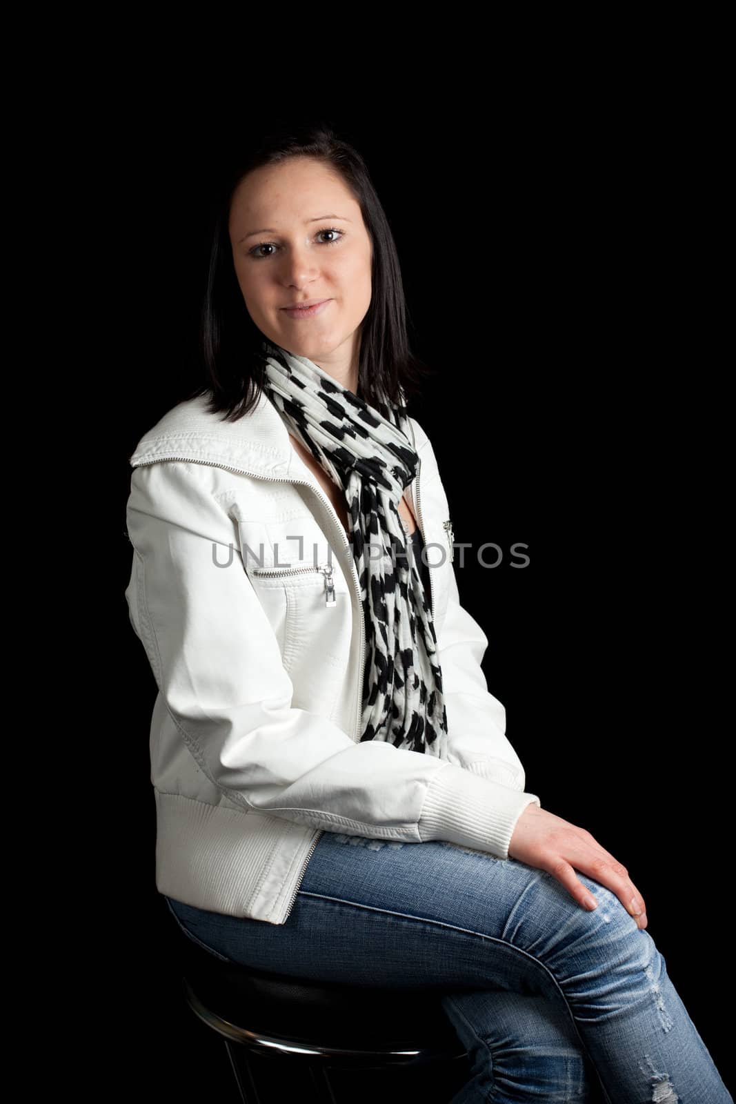 a young woman in casual clothing posing