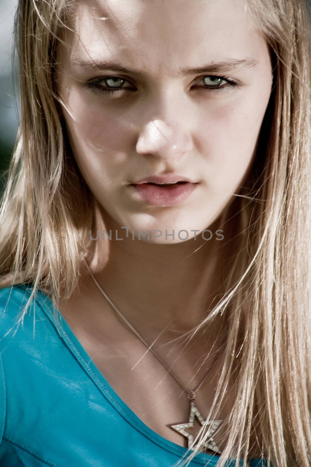 Teenage girl in fresh and happy mood outside in the park