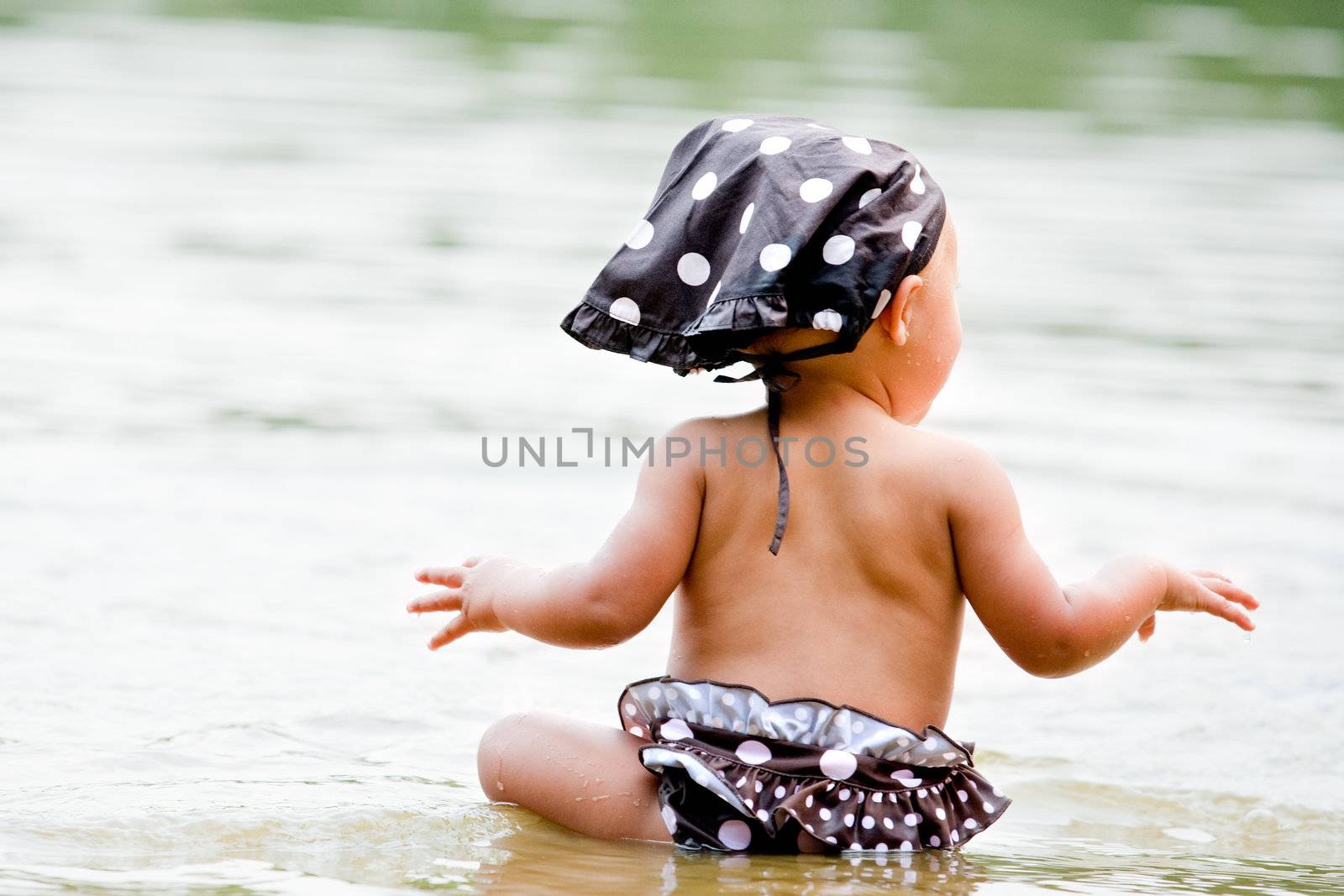 Baby in bikini in the water by DNFStyle