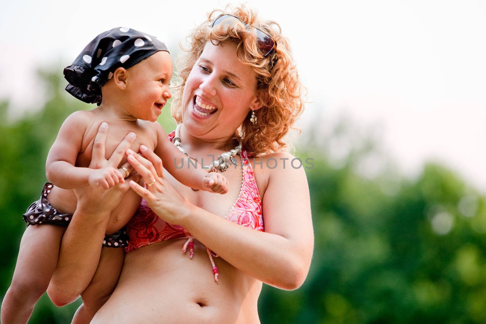 The family and a happy babys first day out in the park