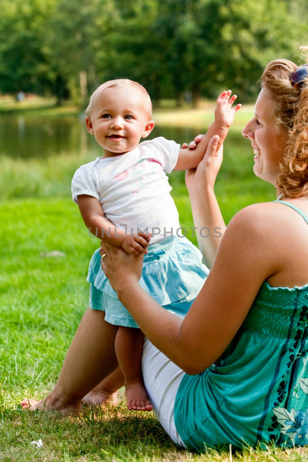 The family and a happy babys first day out in the park