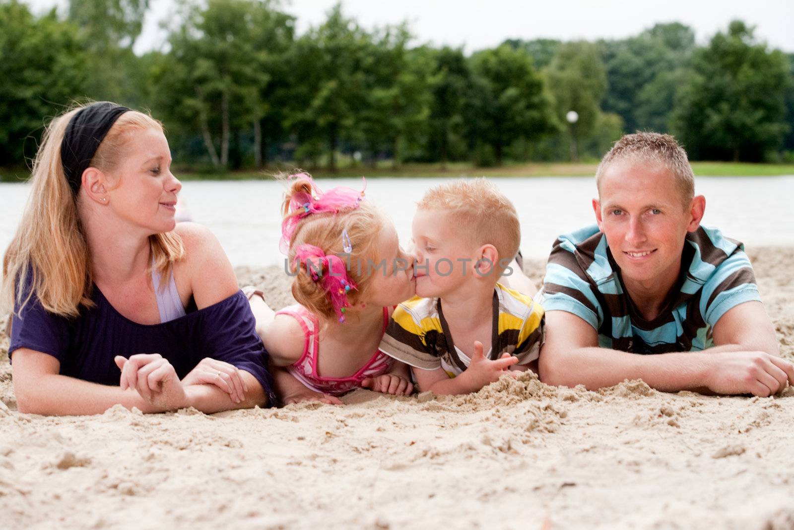 Happy family a day on the beach in the park
