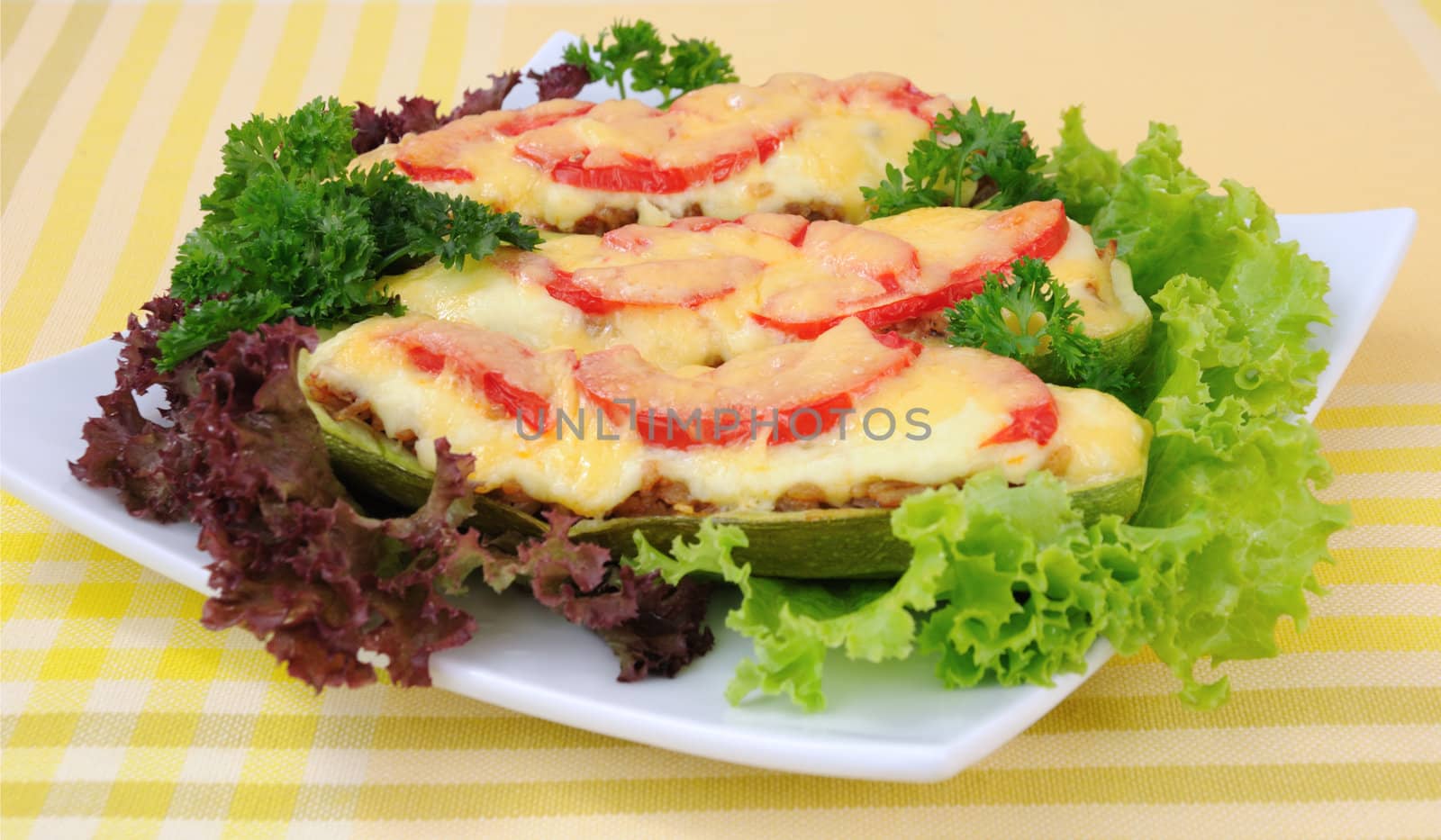 Stuffed zucchini with a mixture of vegetables with tomato  by Apolonia