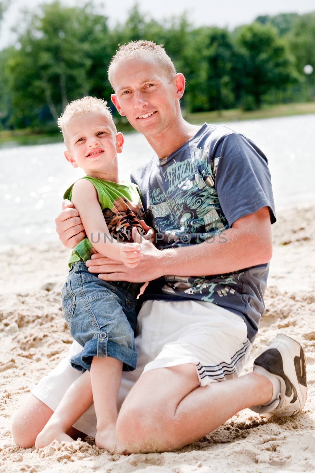 Father and son on the beach by DNFStyle