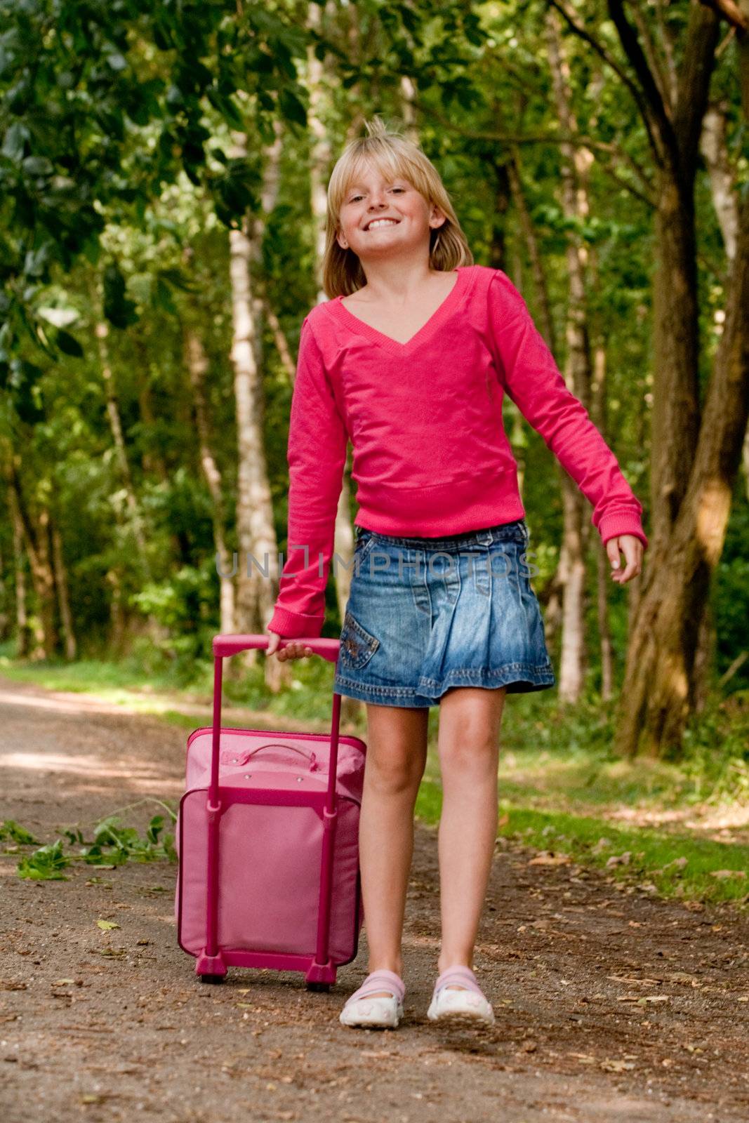 Girl walking with her pink suitcase by DNFStyle