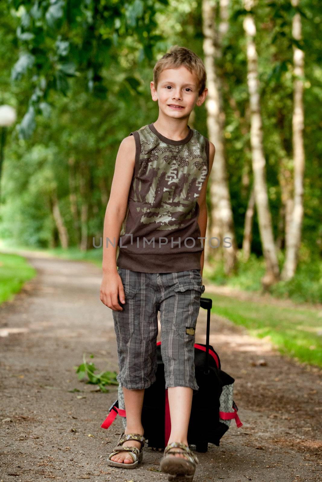 Boy walking with his suitcase by DNFStyle