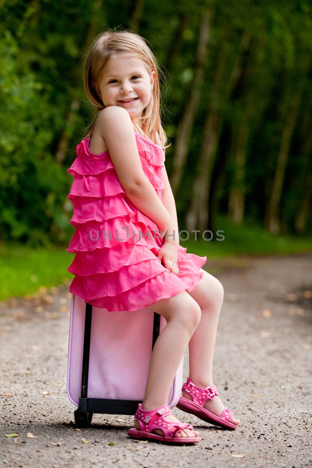 Little girl is sitting on her suitcase by DNFStyle