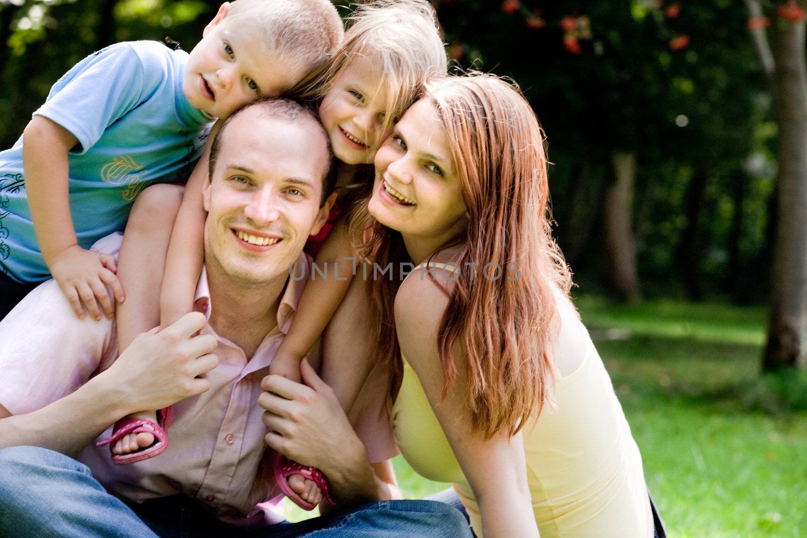 Happy family having a nice vacation in the park
