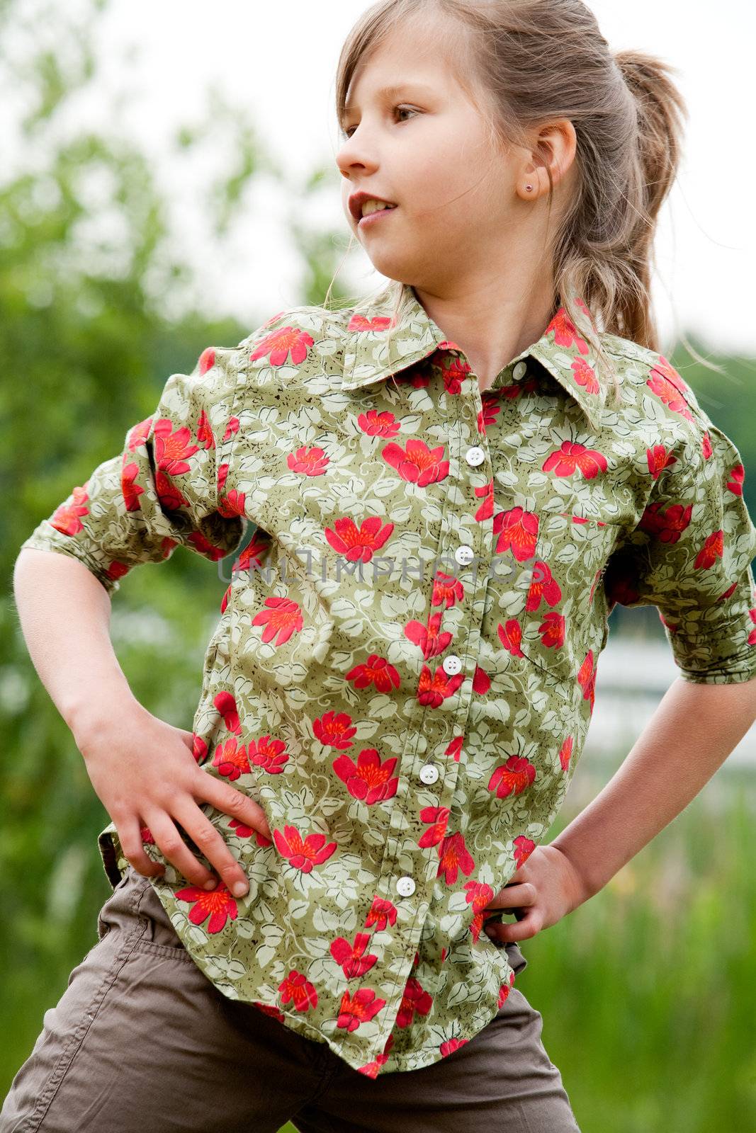 Young talented girl is posing like a little model