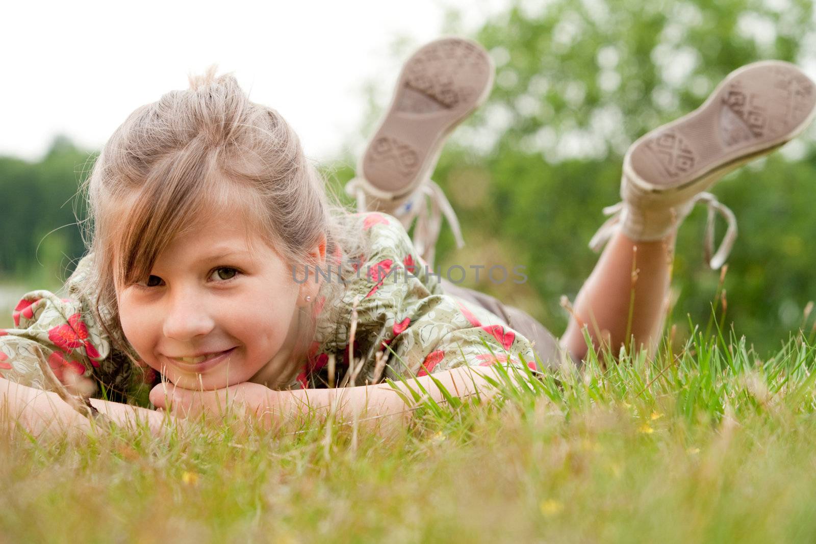 Young talented girl is posing like a little model