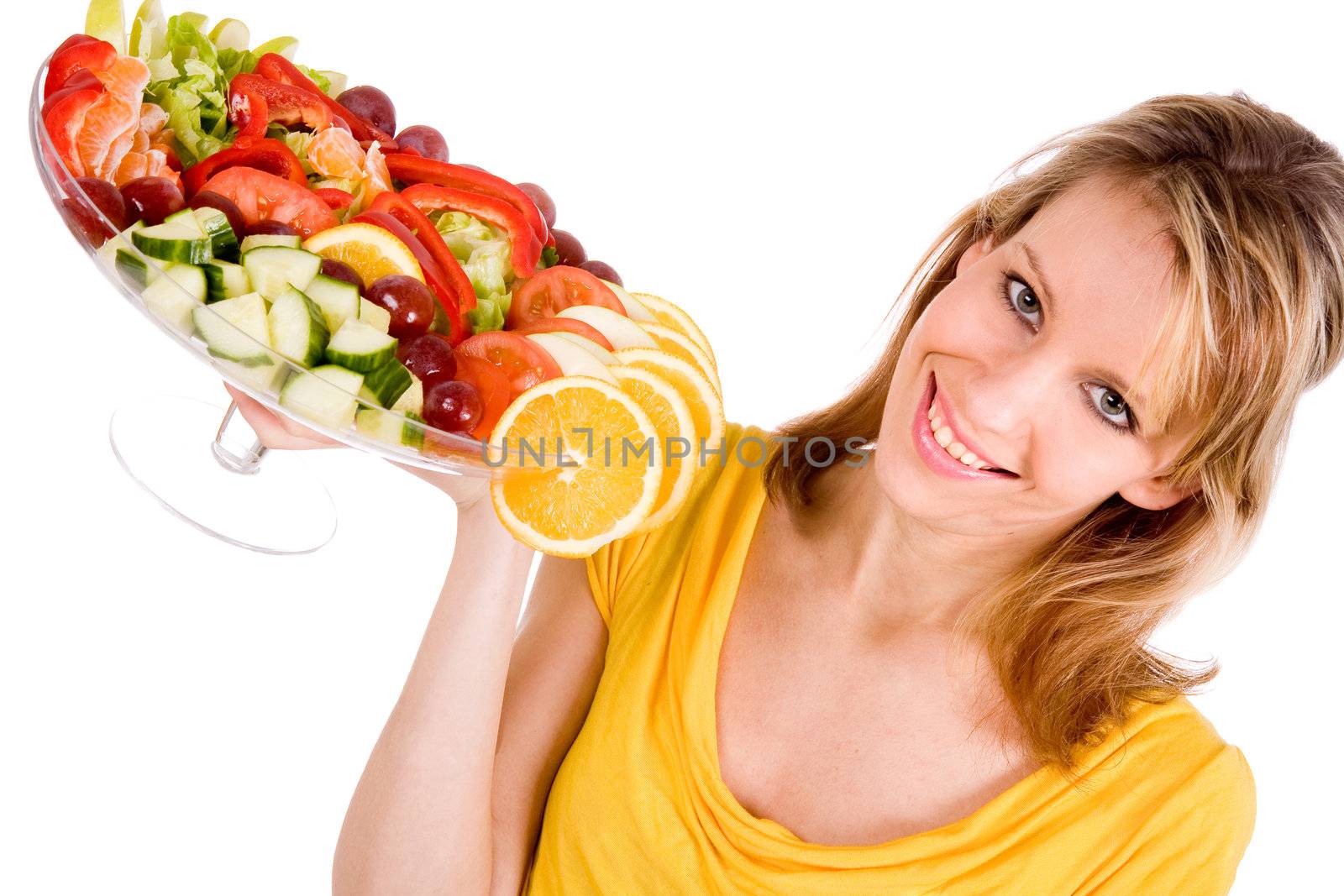 Young girl is presenting a delicous salad