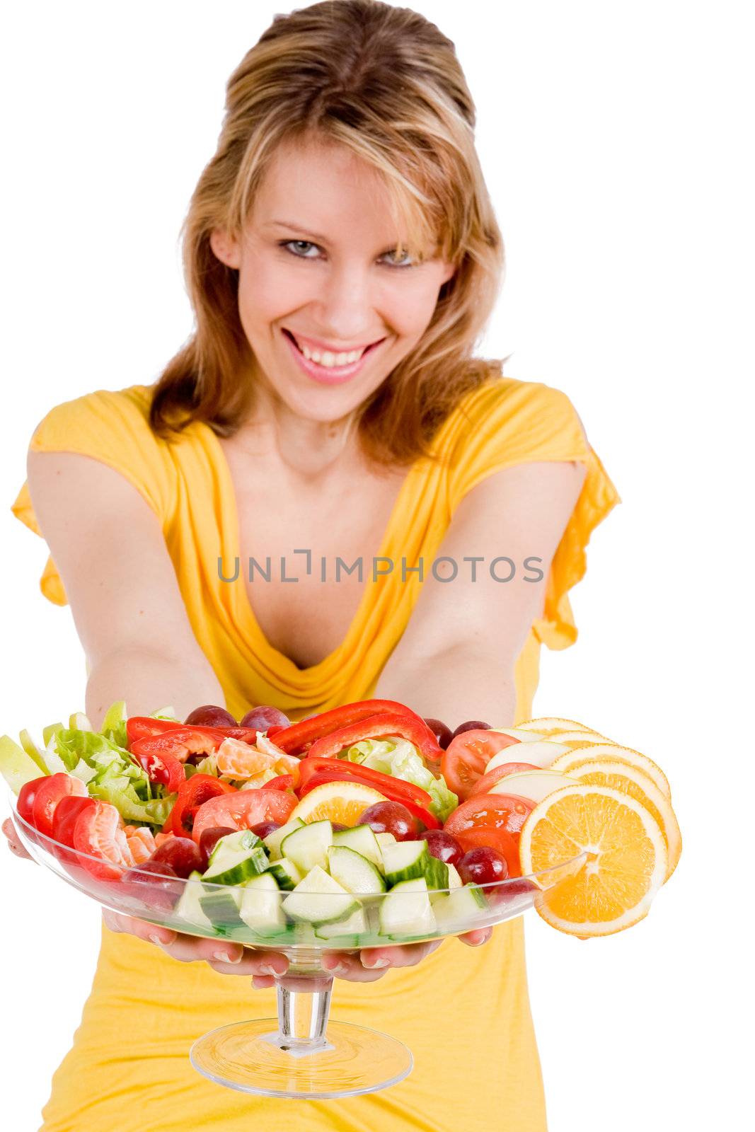 Young girl is presenting a delicous salad