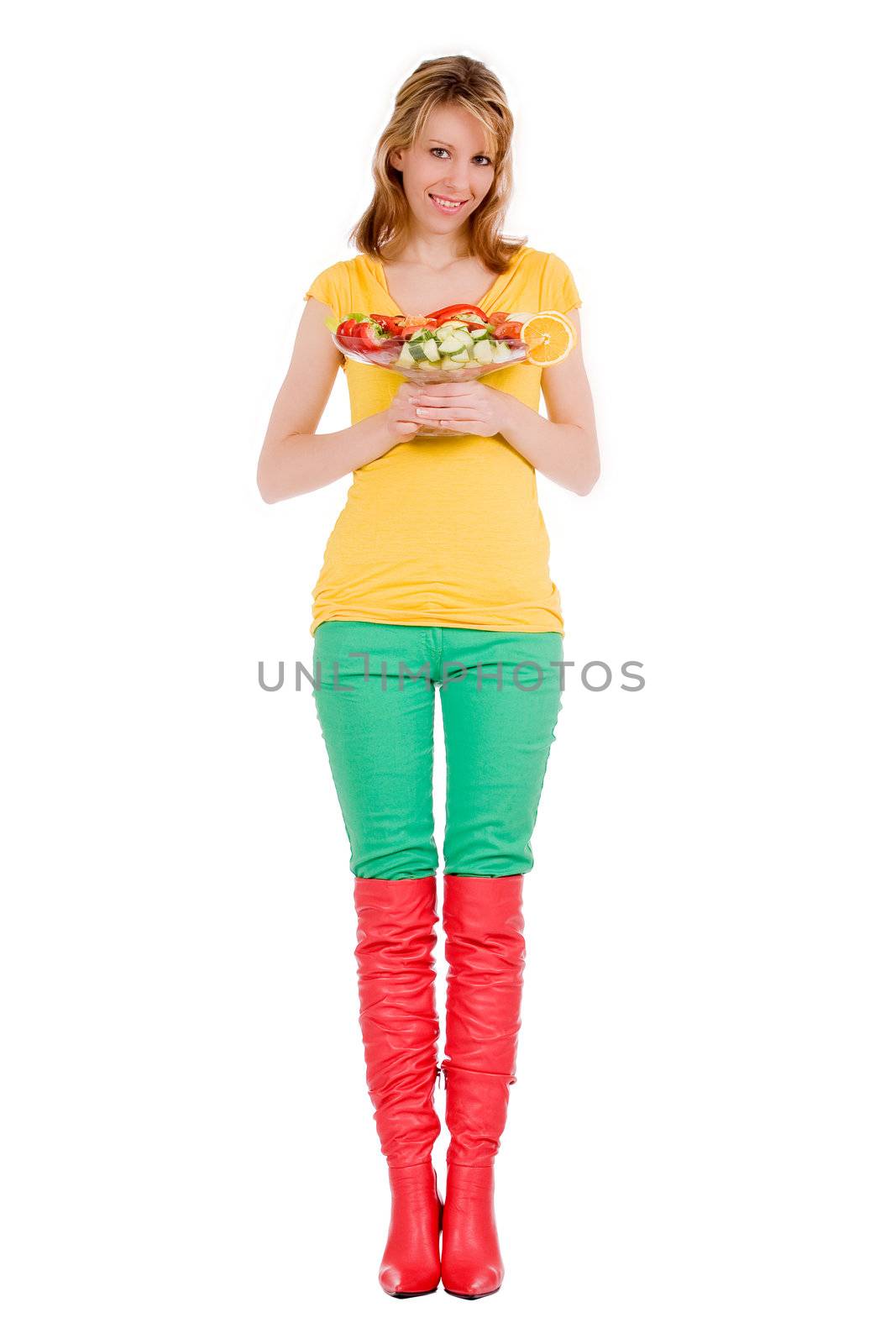 Young girl is posing with a delicious salad
