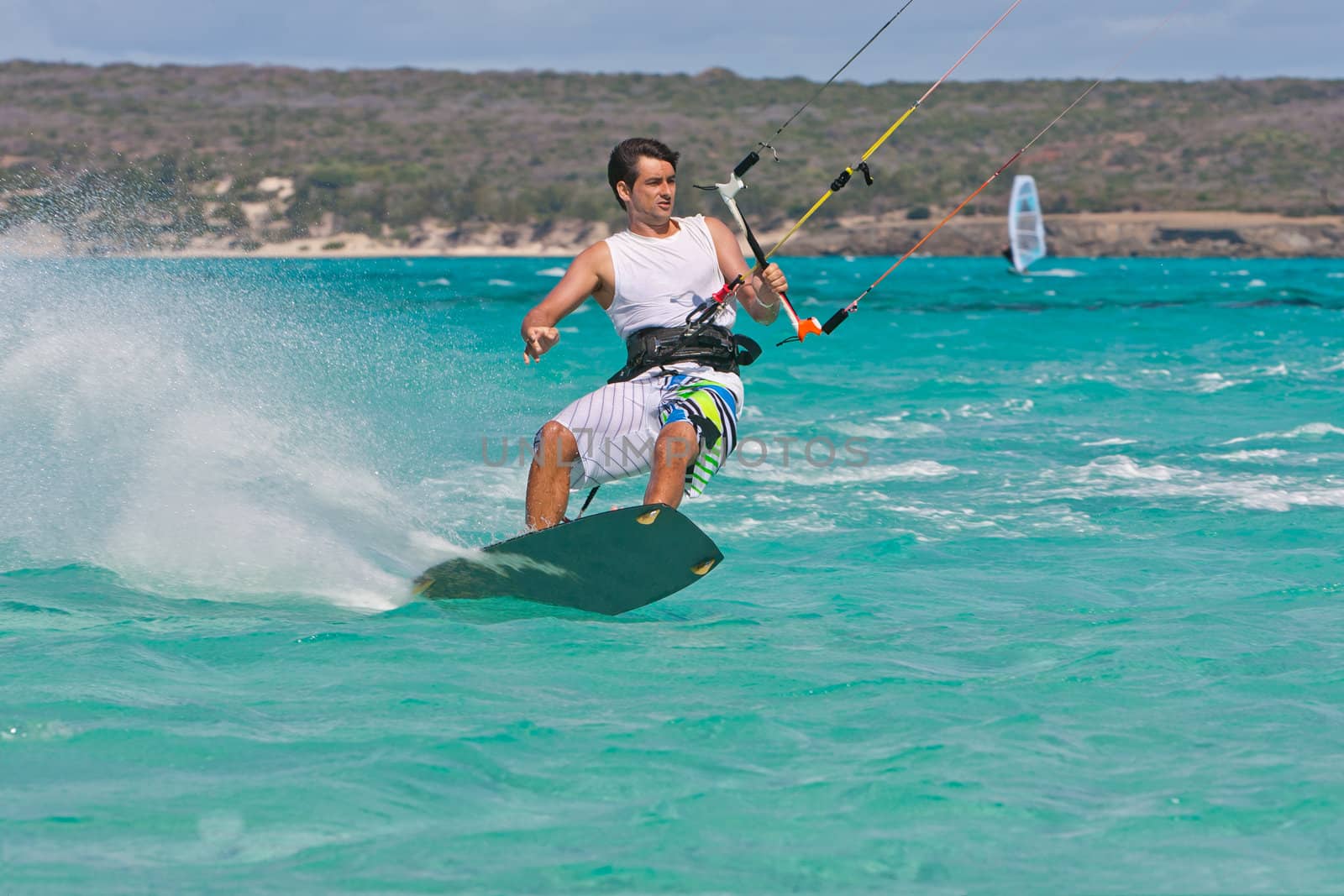 Male kitesurfer enjoying his sport in the lagoon of Babaomby, Madagascar