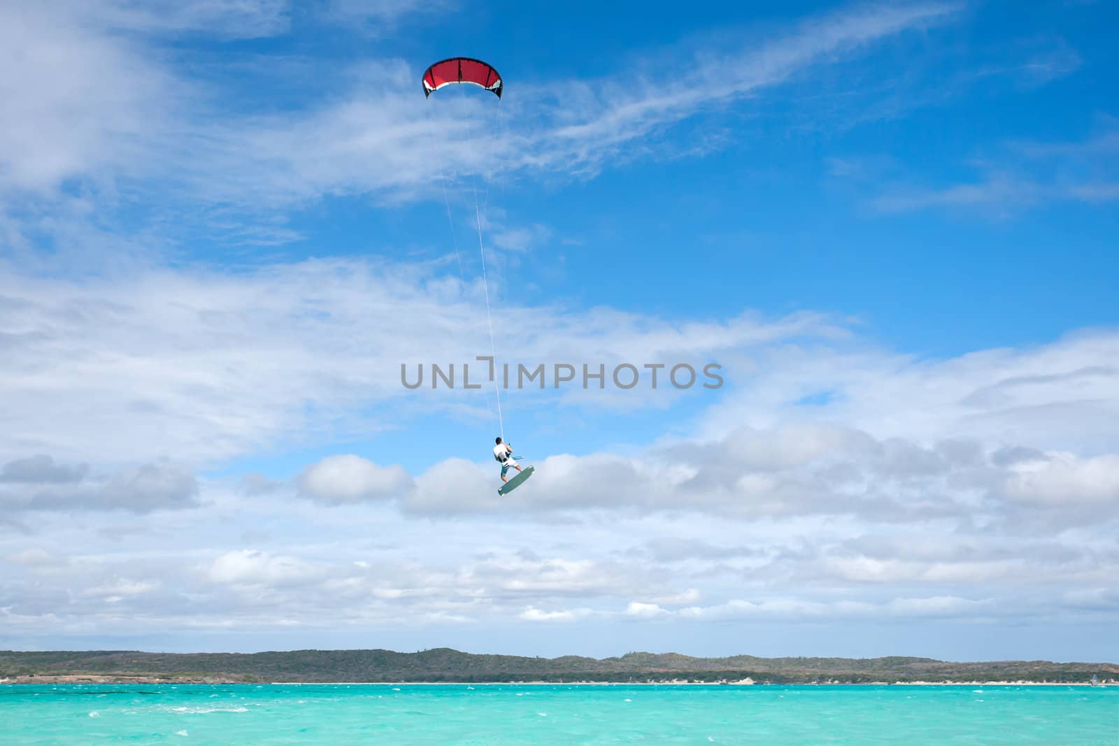 Male kitesurfer jumping in the lagoon of Babaomby, Madagascar