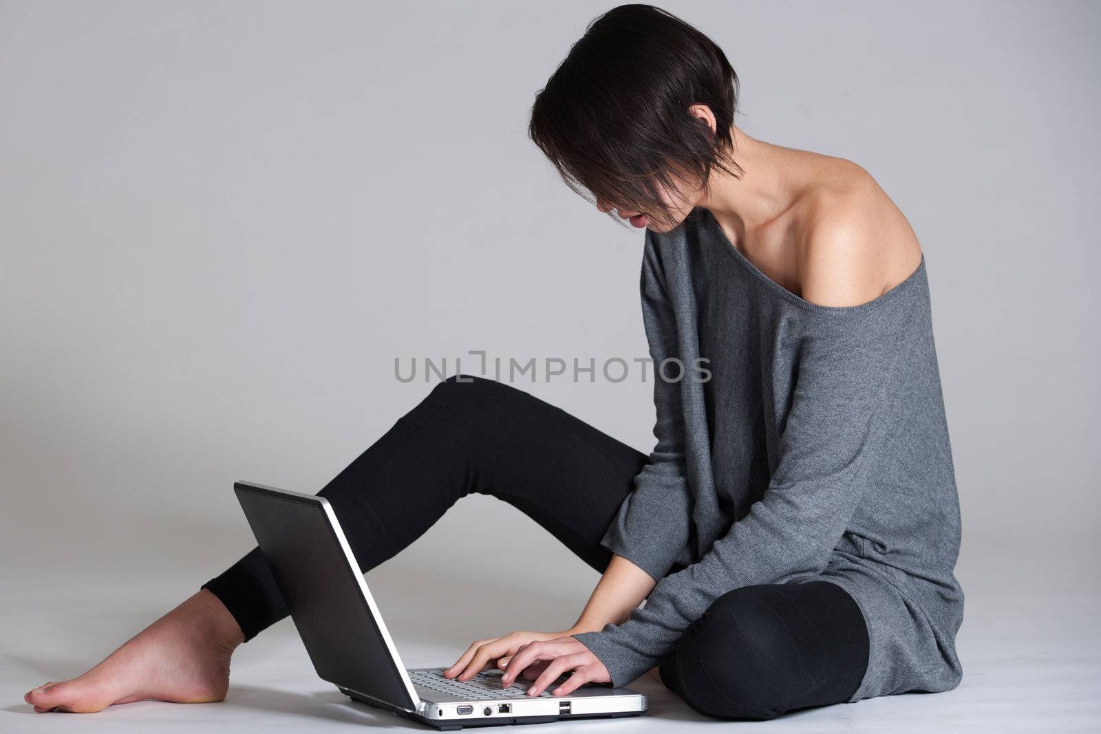 Young woman on floor with notebook by DNFStyle
