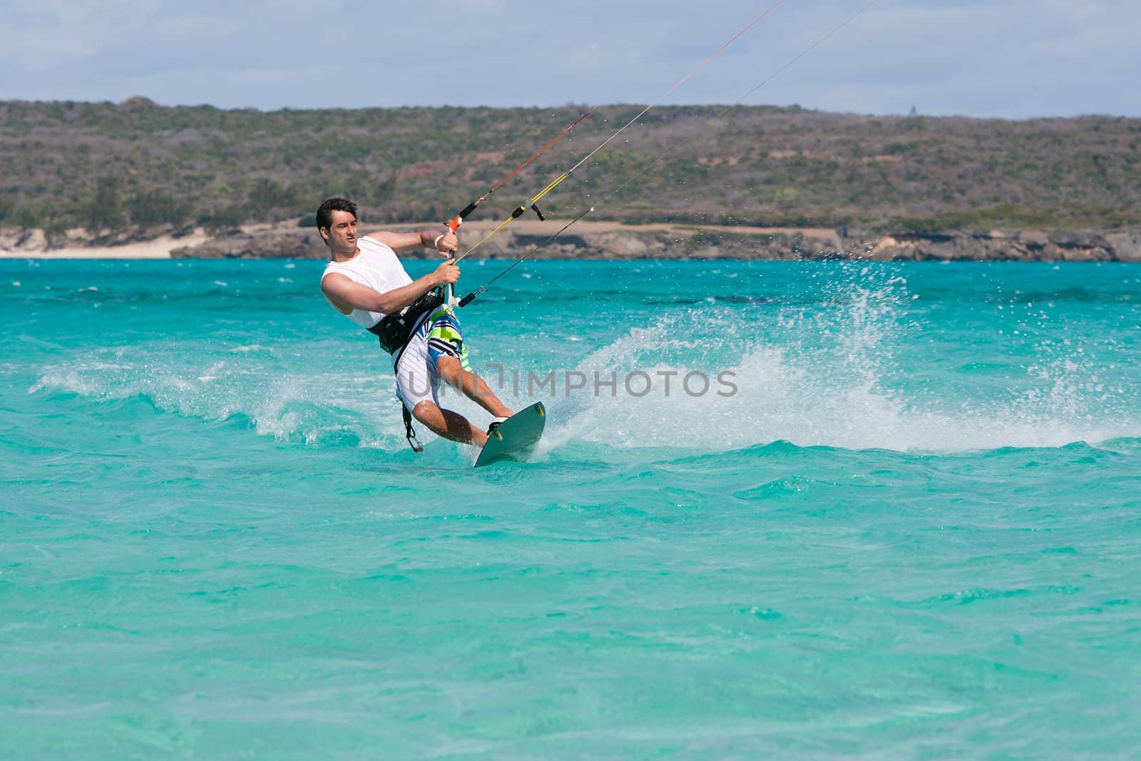 Male kitesurfer kitesurfing in the lagoon of Babaomby, Madagascar