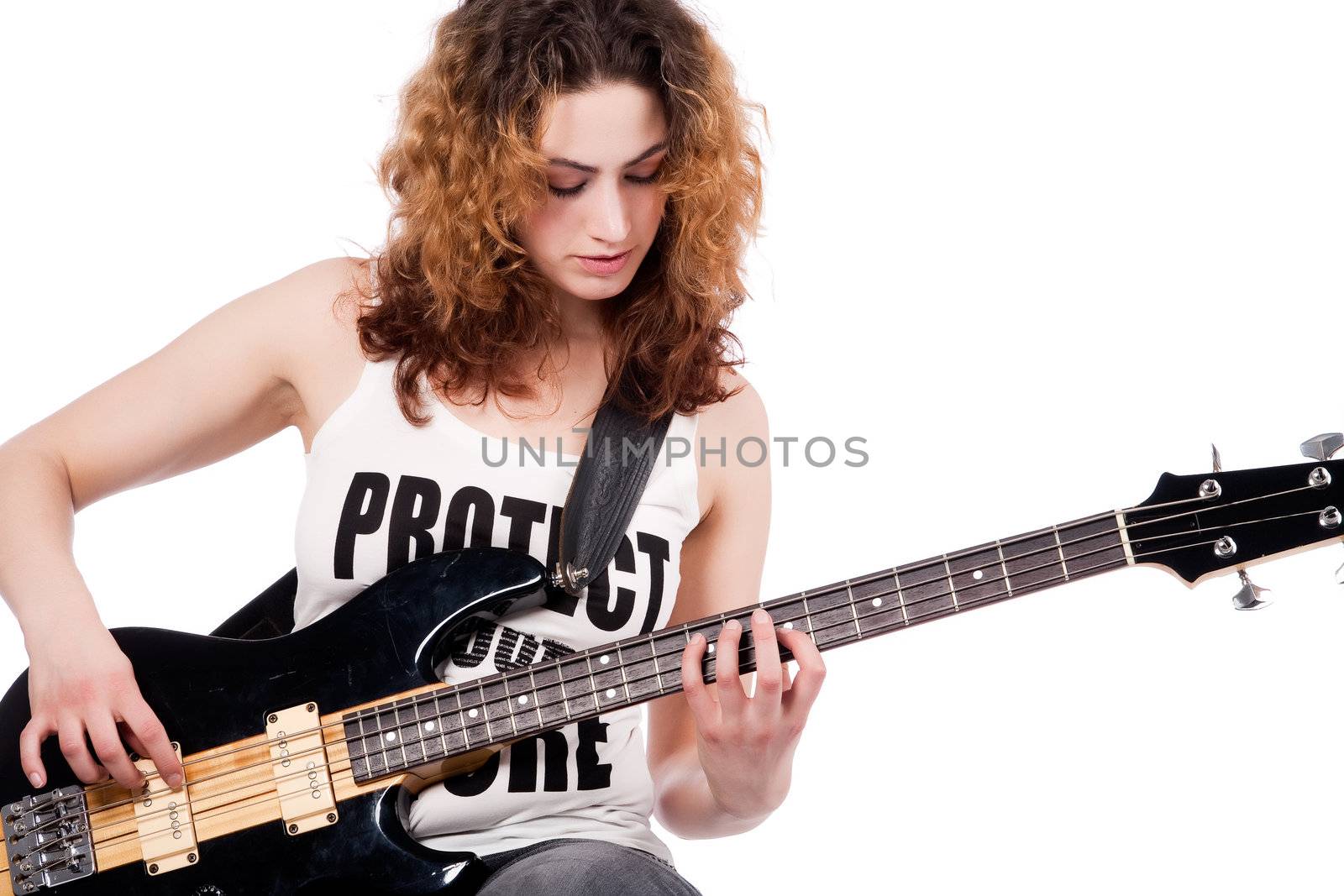 Young female bass guitar player specially isolated on white