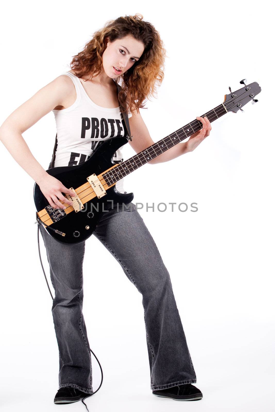 Young female bass guitar player specially isolated on white